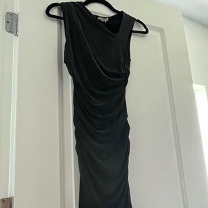 A beautiful black dress with the tag of $295 still attached.